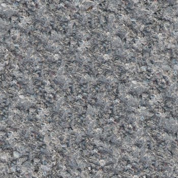 Detailed close-up of a rough gray concrete texture, ideal for backgrounds.