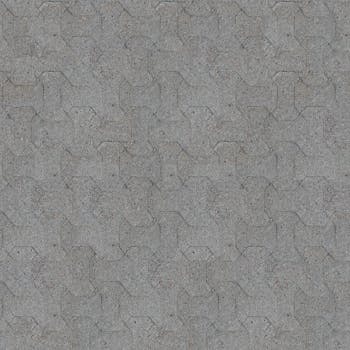 Gray concrete paving stones in an interlocking pattern creating a textured surface.