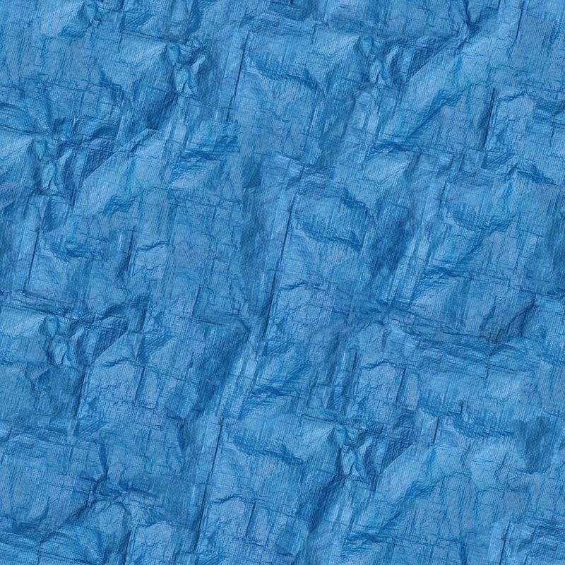 Creased blue woven site sheeting — photo by Seamlesstextures on Pexels