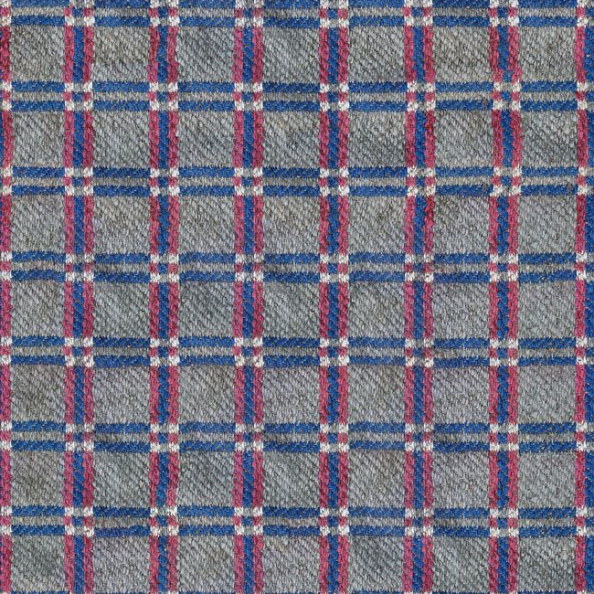 Vibrant tartan fabric featuring red, blue, and white stripes, perfect for fashion design.