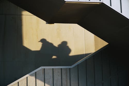 Shadow of Persons on a Tiled Wall