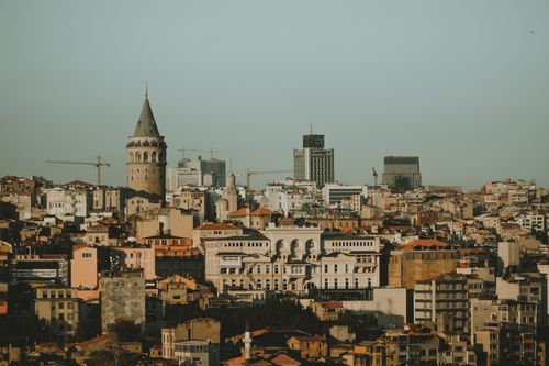 Free Istanbul skyline featuring the iconic Galata Tower and a dense array of buildings under a clear sky. Stock Photo
