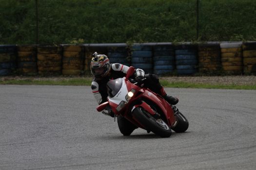 Red and Black Sports Bike on Road
