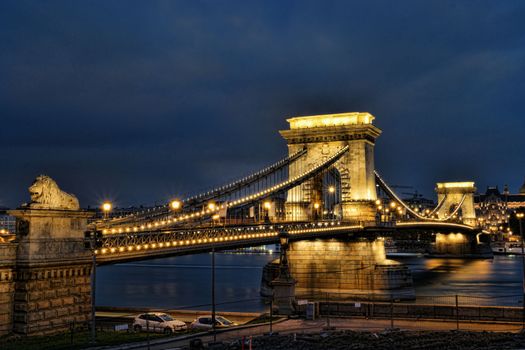 Night view of the illuminated Szechenyi Chain Bridge in Budapest over the Danube River.