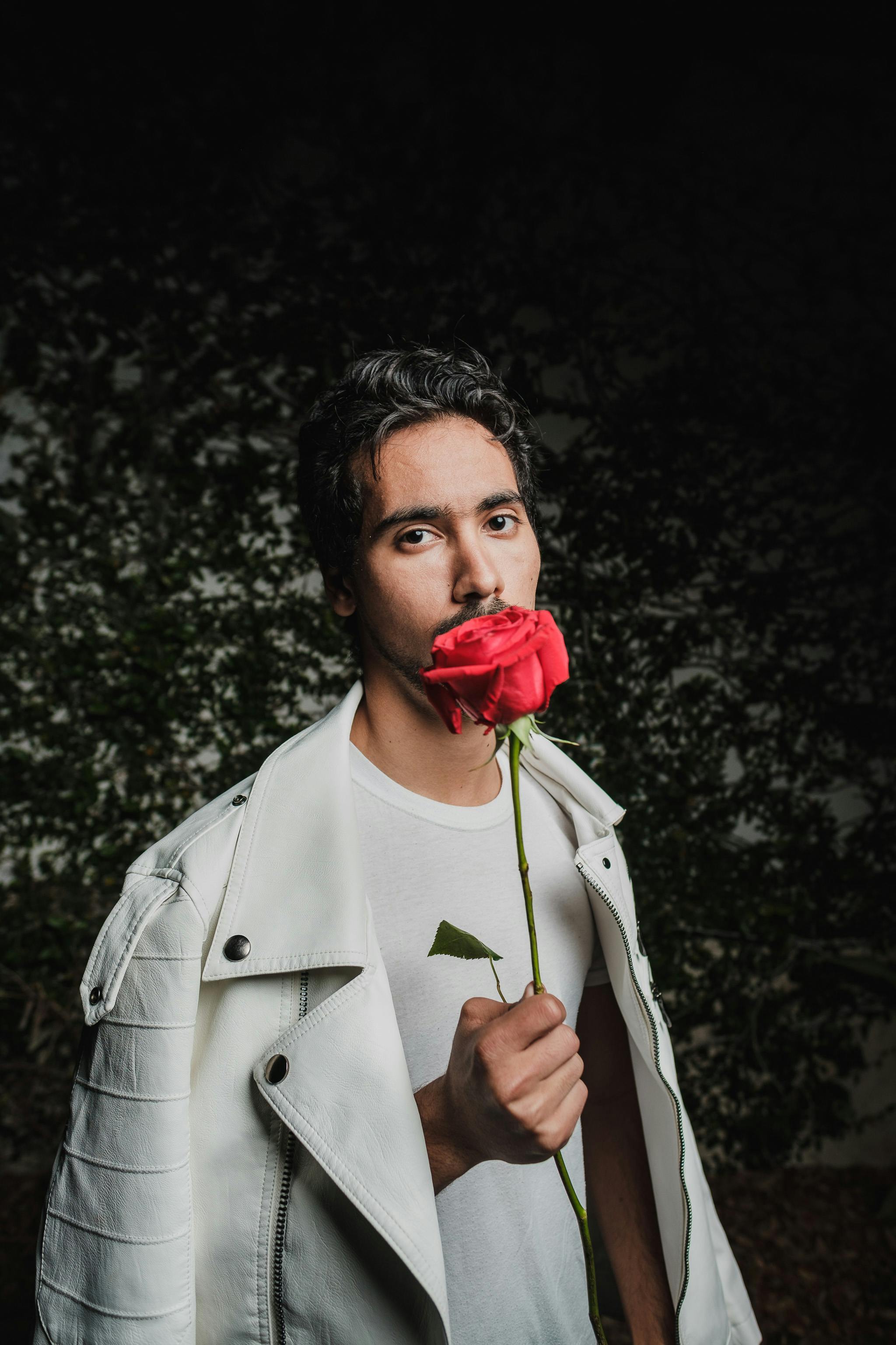 man holding a flower