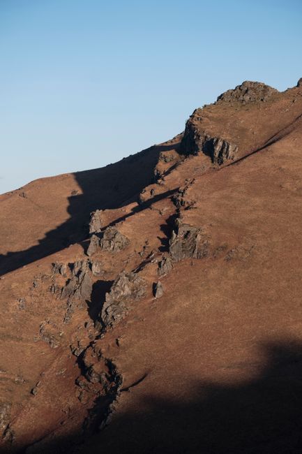 Stunning mountain landscape with rocky terrain and shadows in Nouvelle-Aquitaine, France.