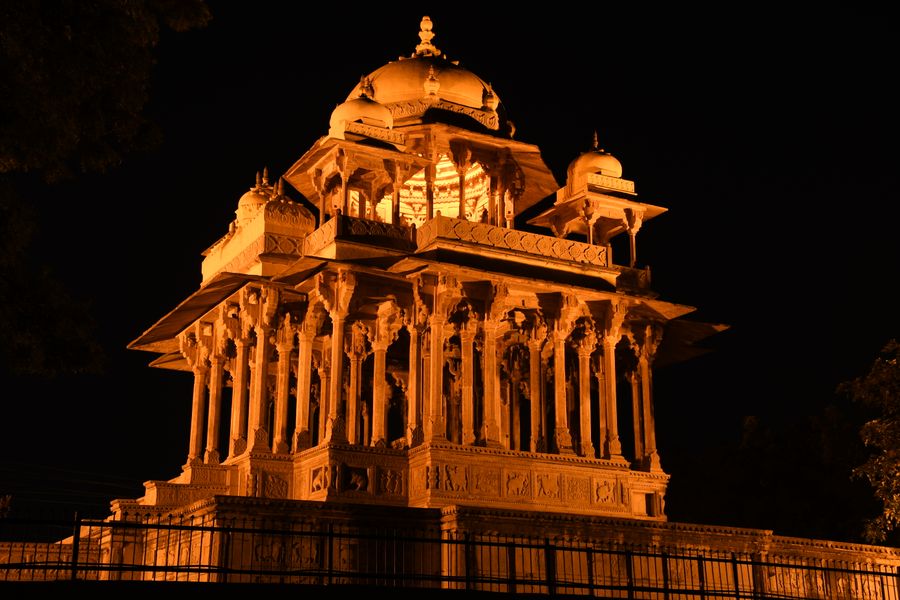 Beautifully lit 84-Pillared Cenotaph in Rajasthan capturing Indian architecture at night.