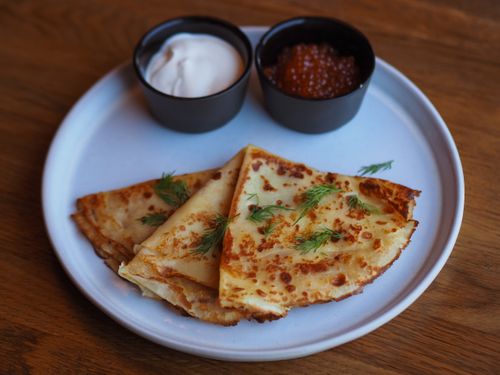 Free Close-up of traditional blinis served with sour cream and red caviar. Stock Photo
