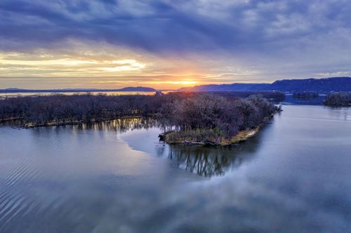 Free A breathtaking aerial photo of a winter sunset over an island and frozen lake in Winona, MN. Stock Photo