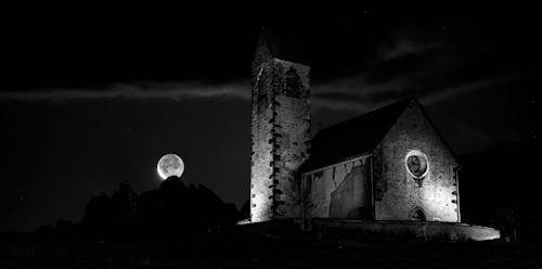 Grayscale Photograph of a Church during the Night