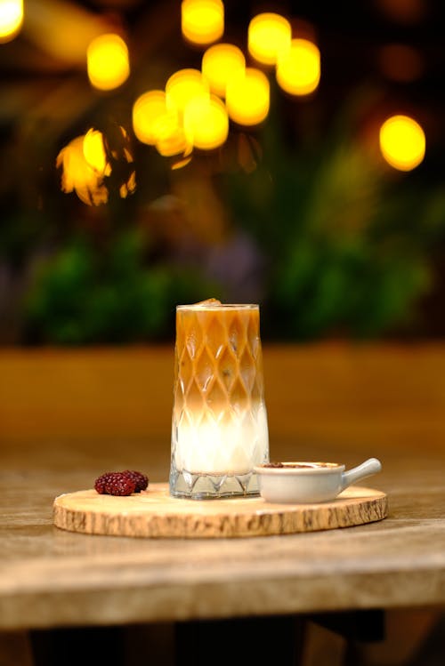 An Iced Coffee Drink on a Wooden Board