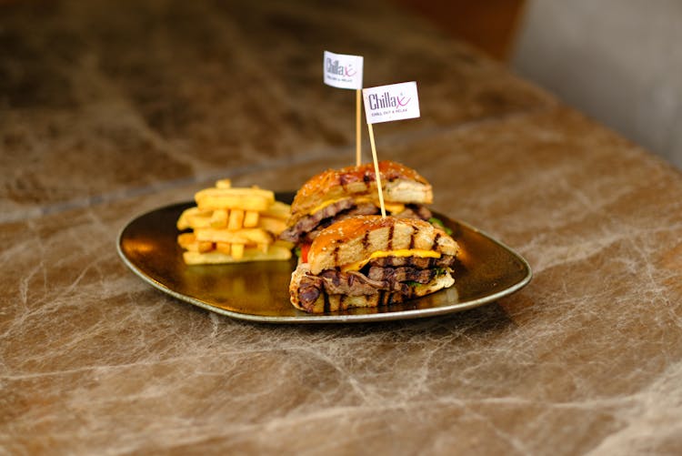 Burger And Fries Served On Plate