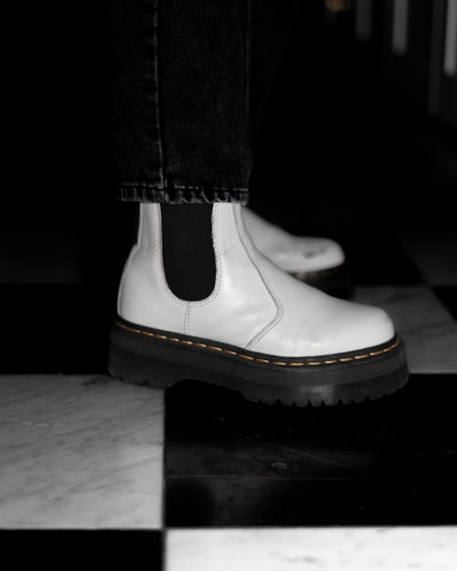 Person Wearing White Boots