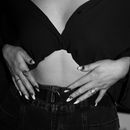 Grayscale Photo of Woman Wearing Black Brassiere and Black Denim Jeans