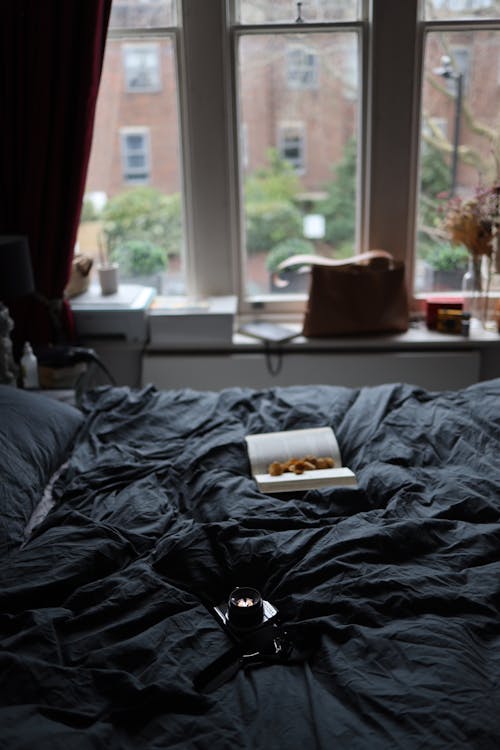 A Bed Near Glass Windows