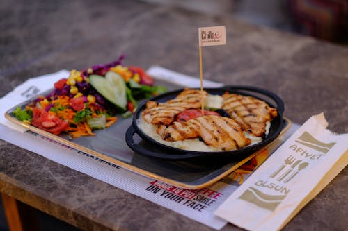 Meal with Grilled Chicken and Salad Served on Tray