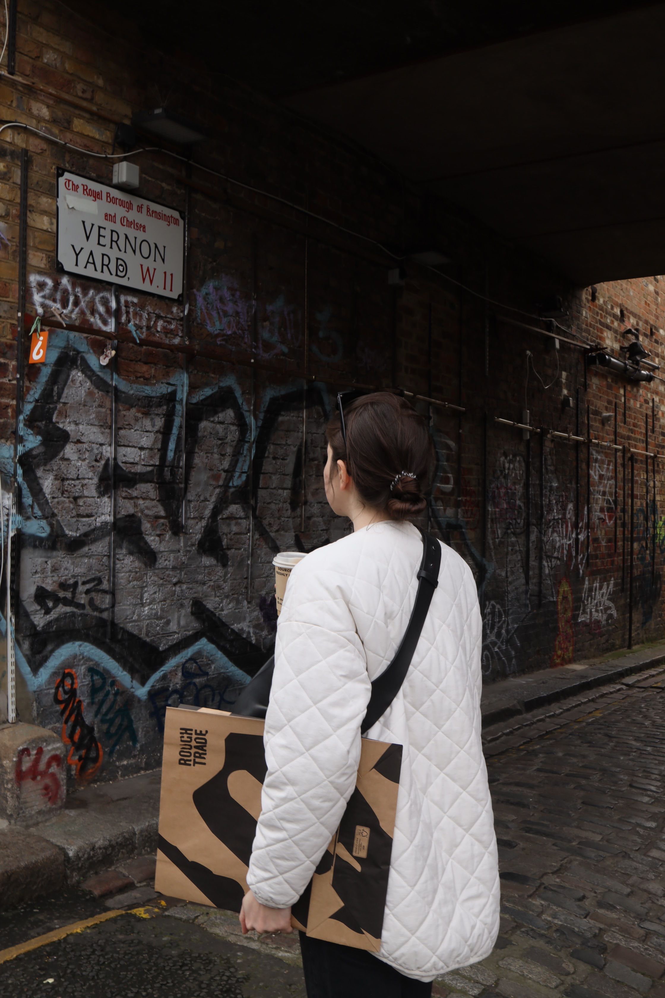 Back View of a Woman in a White Jacket · Free Stock Photo
