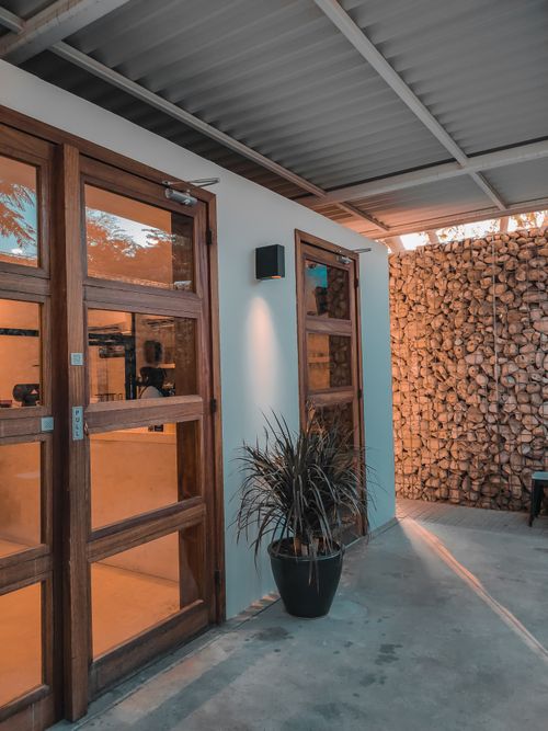 Free Inviting cafe entrance in Dubai featuring sleek wooden doors and a modern design. Stock Photo