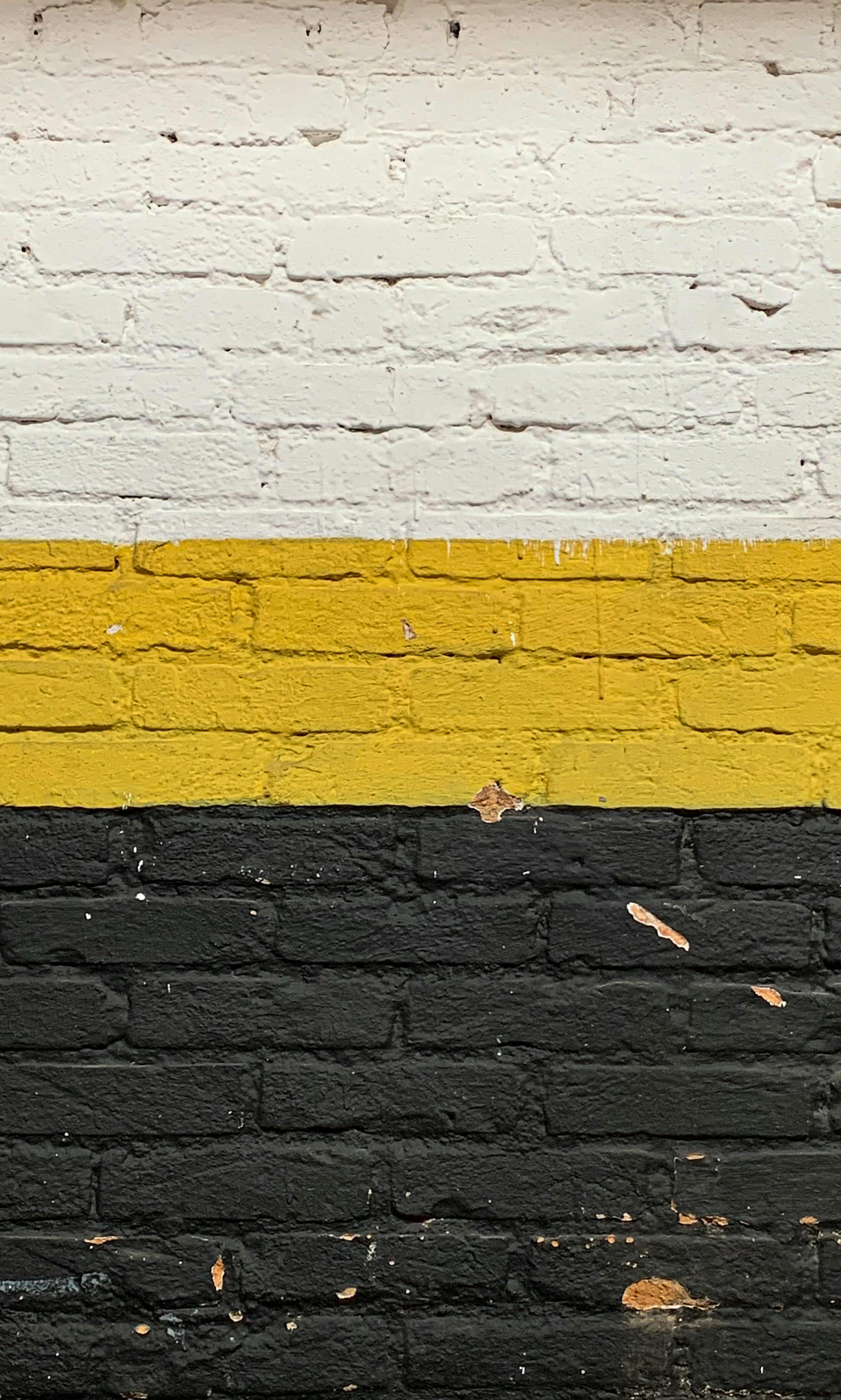 Yellow and Black Brick Wall · Free Stock Photo