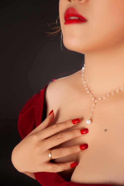 Free Photo of a Woman's Hand on Her Chest Stock Photo