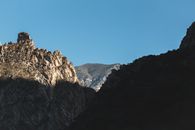 Person Standing on Rocky Mountain