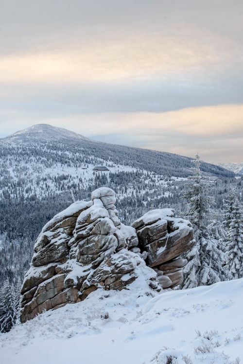 Free Scenic view of snowy mountains and rock formations in a winter landscape. Stock Photo