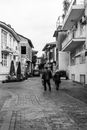 Grayscale Photo of 2 Person Walking on Street