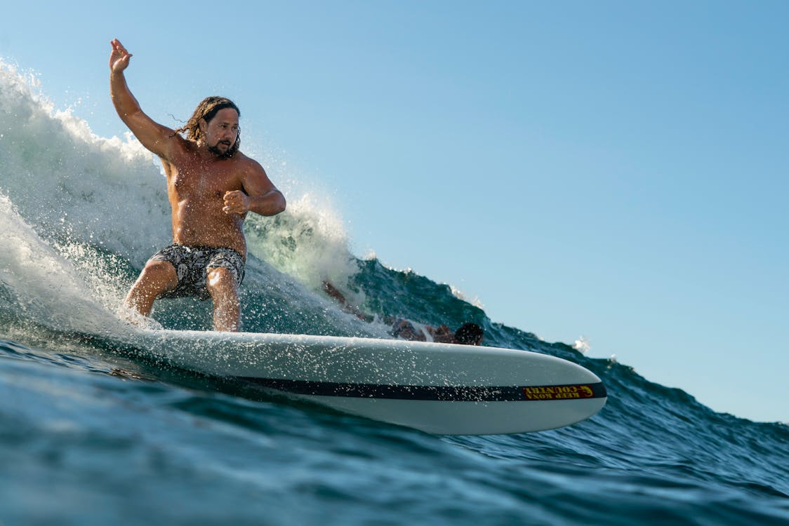 Shirtless Man Surfing