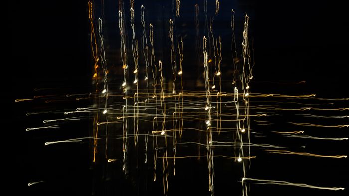 Abstract dark graphic with crossing arcs &mdash; photo by Ludvig Hedenborg on Pexels