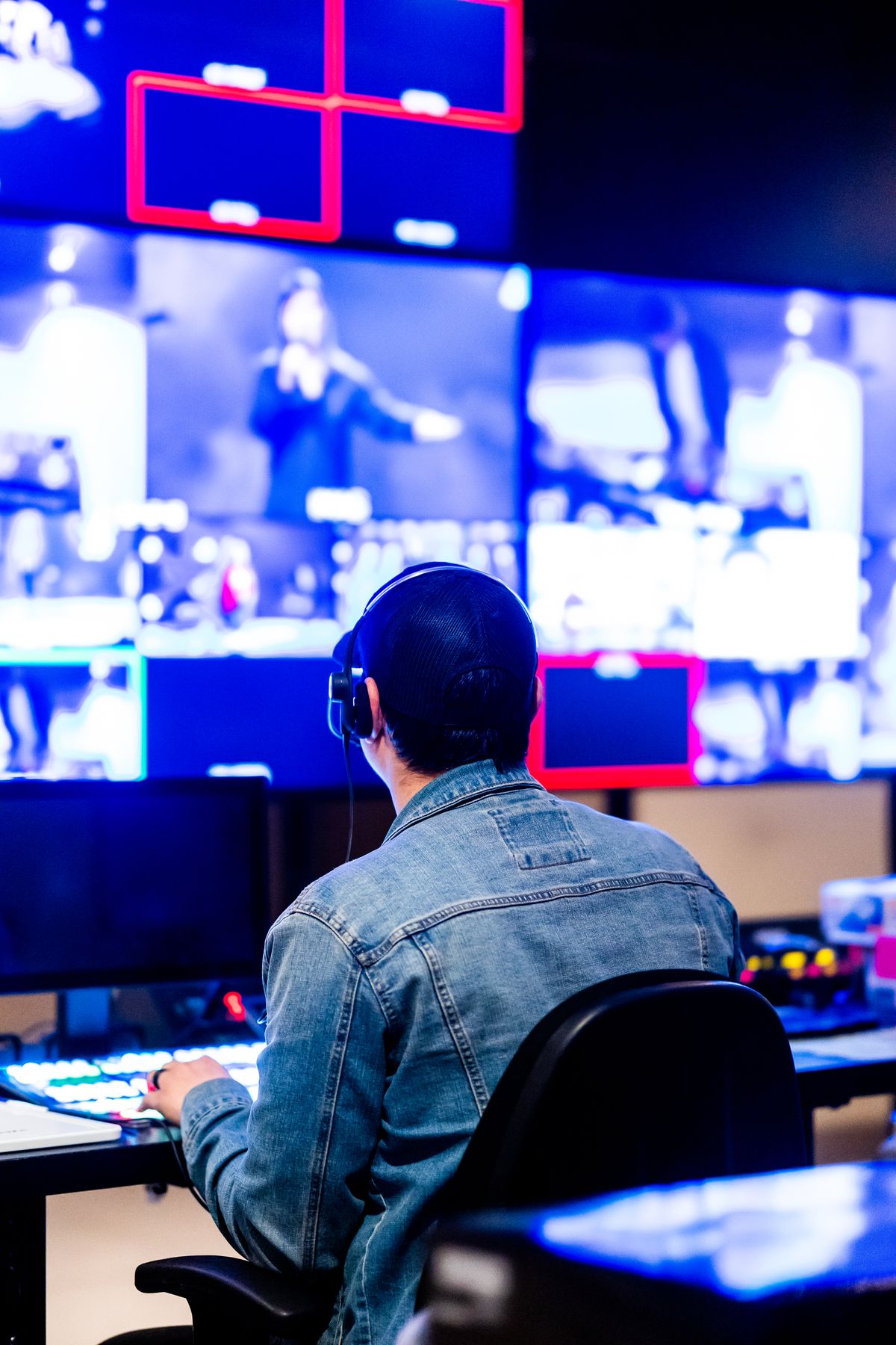 Creative operator working across multiple studio screens