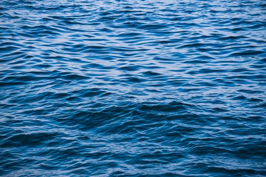 A serene view of blue ocean waves and tranquil ripples, perfect for backgrounds.