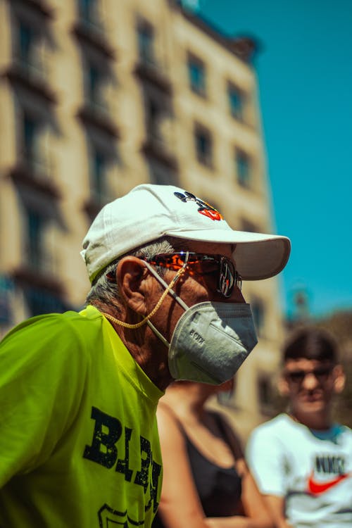 Portrait of a Man with a White Cap Wearing a Face Mask