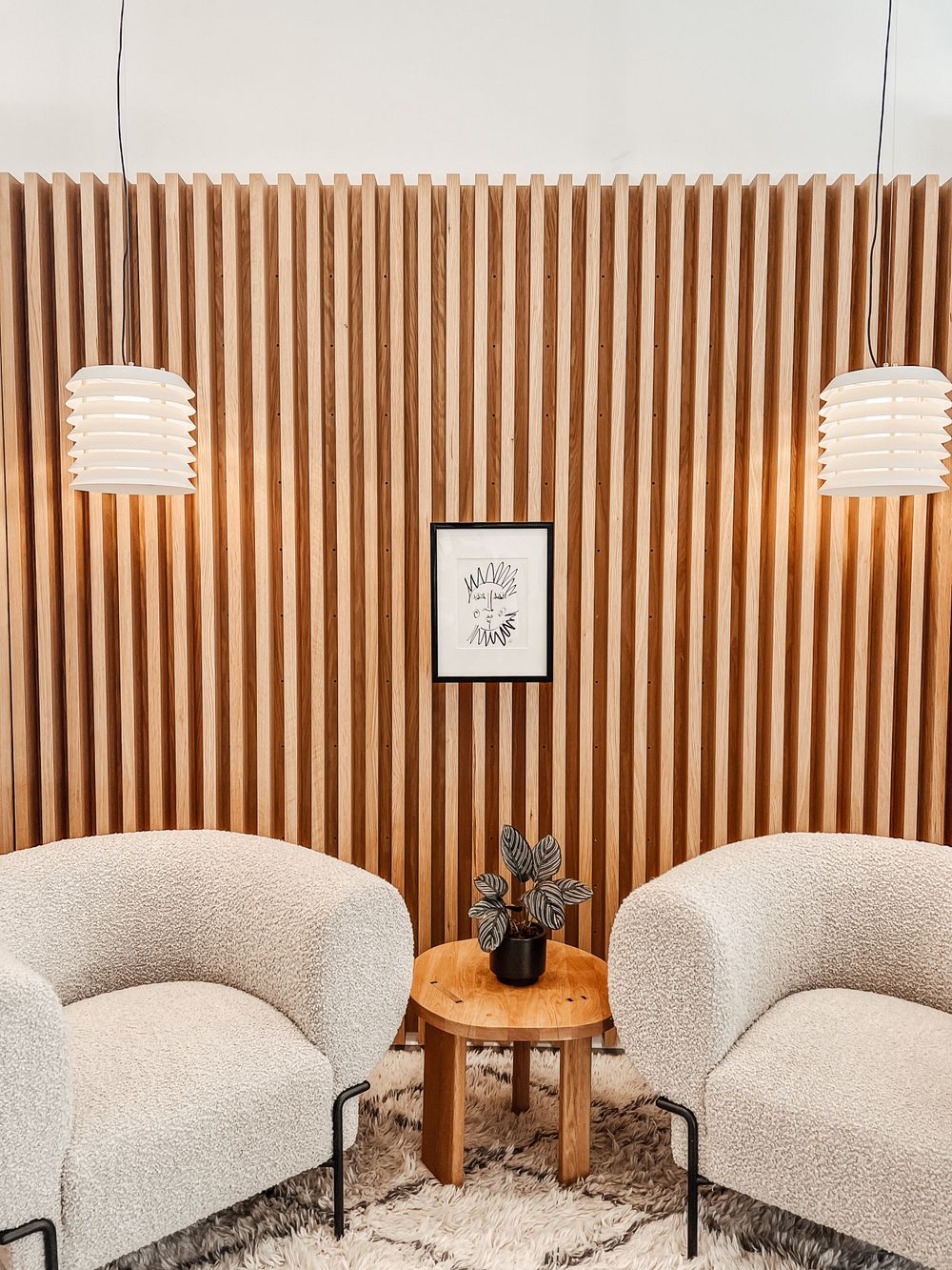 Warm therapy office interior with boucle armchairs — Photo by Philip Warp on Pexels