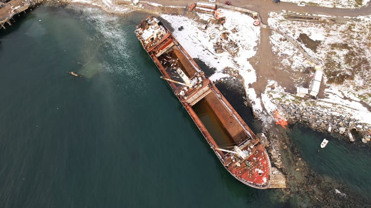 Barge Ship In Water Near Seashore