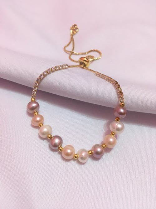  Pearl Bracelet on White Textile