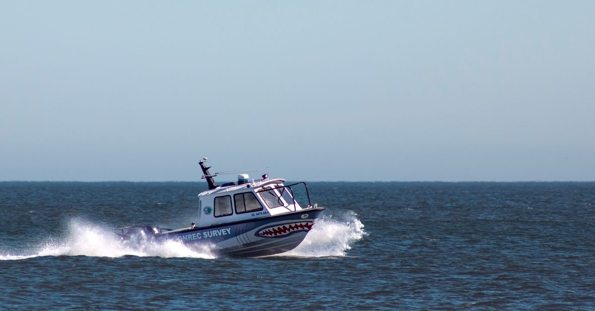 A fast motorboat cutting through the blue sea near Bethany Beach, Delaware.