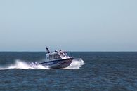 White and Black Boat on Sea