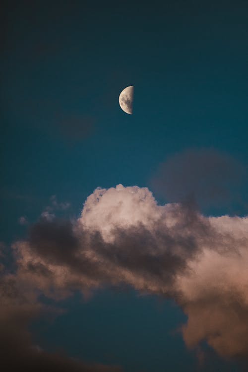 Photo of the Moon Near the Clouds