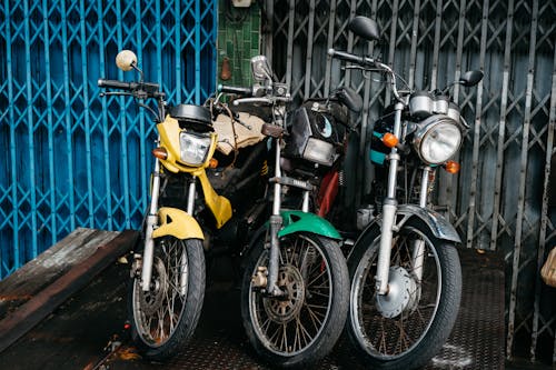 Motorcycles near Fence