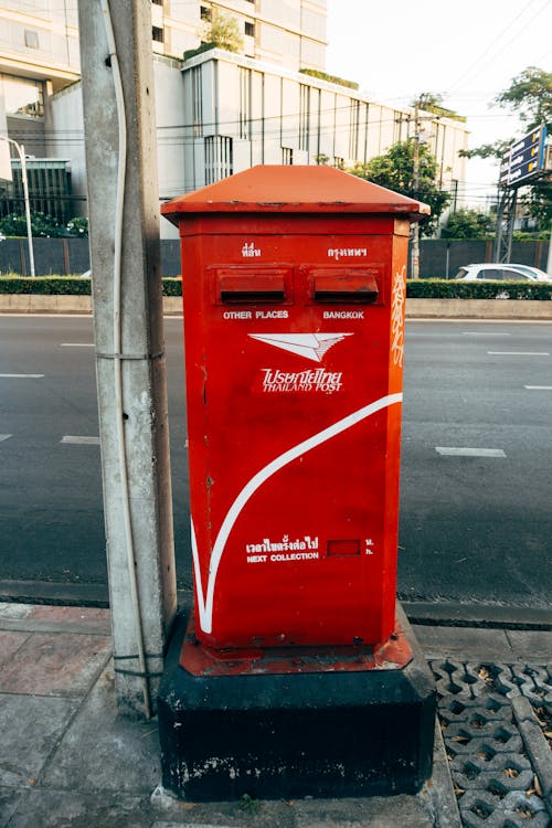 Red Mailbox Near Asphalt Road