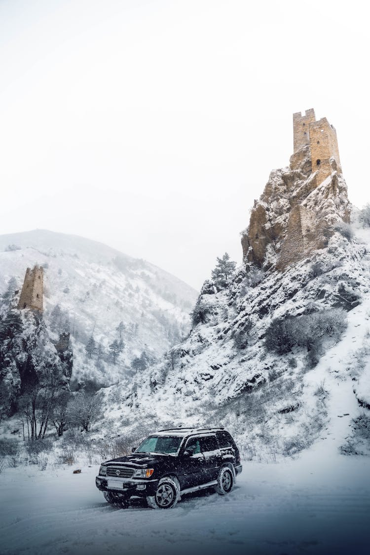 Car In Mountains On Winter Day