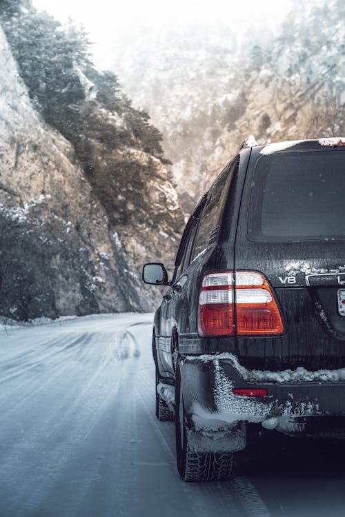 Car Driving on a Snowy Road