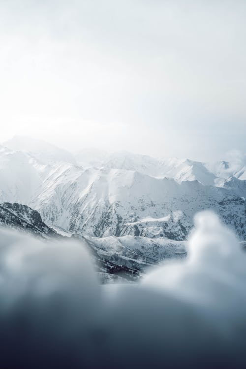 Free Landscape Photography of a Snow Covered Mountain Range Stock Photo
