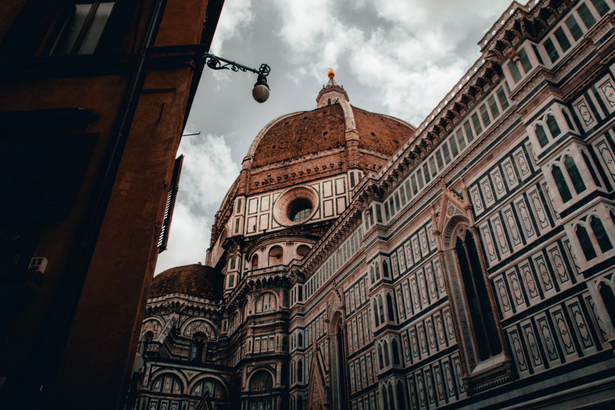 Florence Cathedral Santa Maria del Fiore with Brunelleschi dome and Giotto Bell Tower at sunset