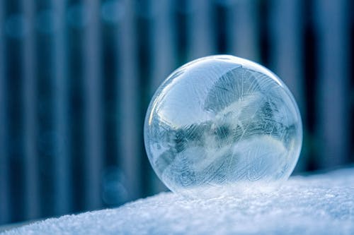 Free Glass Ball on White Surface Stock Photo