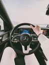 Person Driving a Mercedes Benz Car while Raining