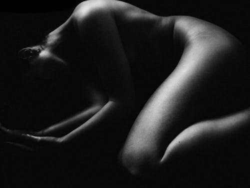 Grayscale Photo of a Naked Woman