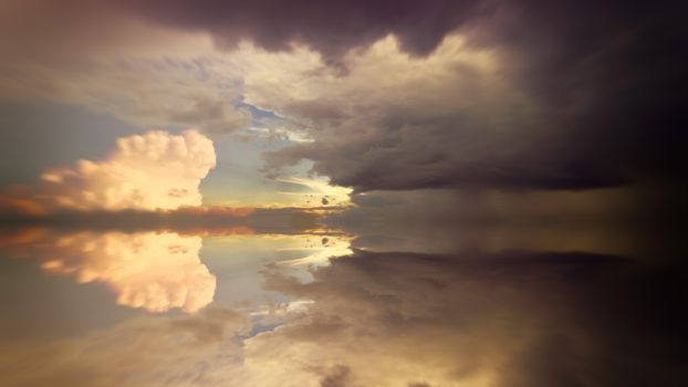 Stunning dramatic cloud reflections on ocean water during dusk, showcasing nature's beauty.
