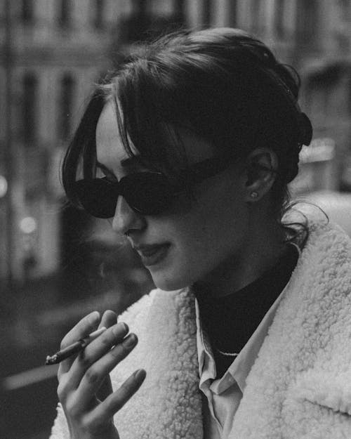 Free Grayscale Photo of a Woman Smoking a Cigarette Stock Photo