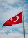 Red and White Flag Under Blue Sky